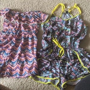 2 multicolored romper size small. Never worn